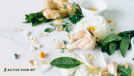 Assorted adaptogen herbs and roots, including ashwagandha and ginseng, displayed on a wooden table for natural wellness