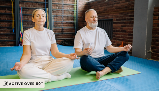 A man and woman meditating in a yoga class
