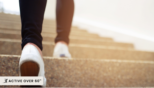 Close-up of a person wearing sneakers, walking outdoors, symbolizing the link between footwear choice, balance, and overall strength.