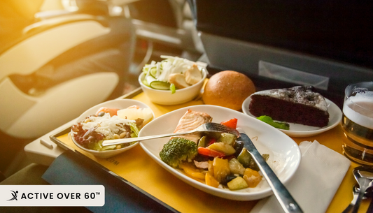 an airplane tray with food and drinks on it