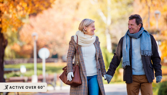 A couple walking in an autumn park