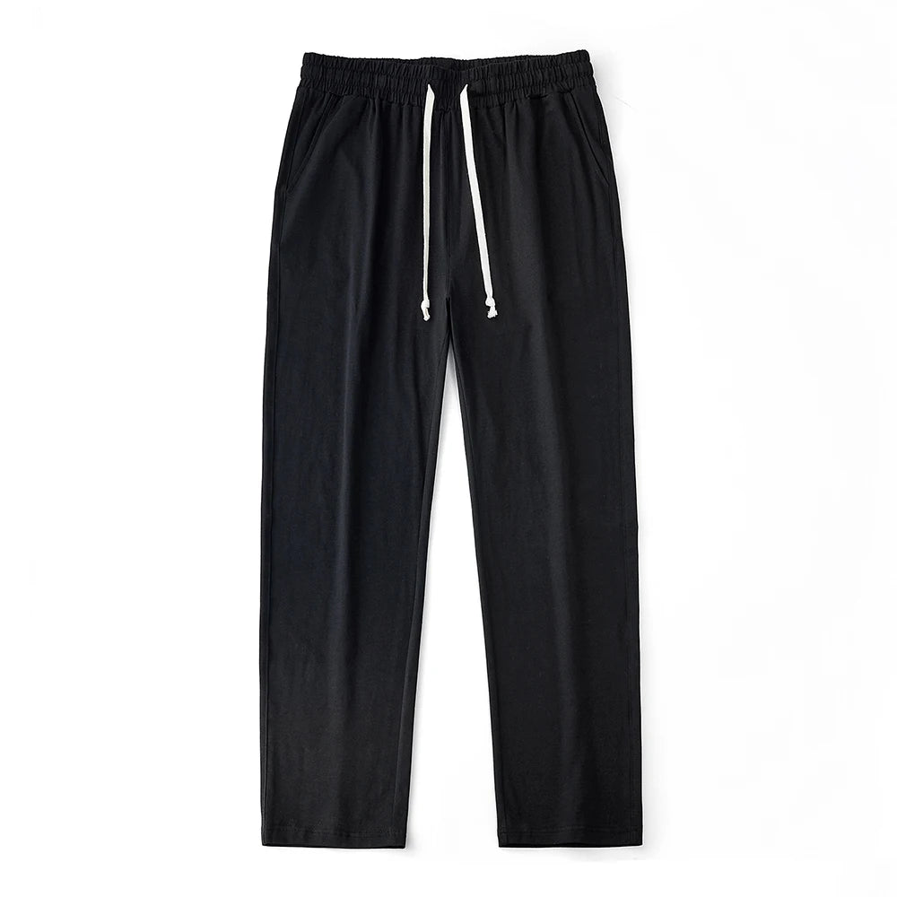 Men’s solid color sport pants with drawstring waist and straight-leg fit