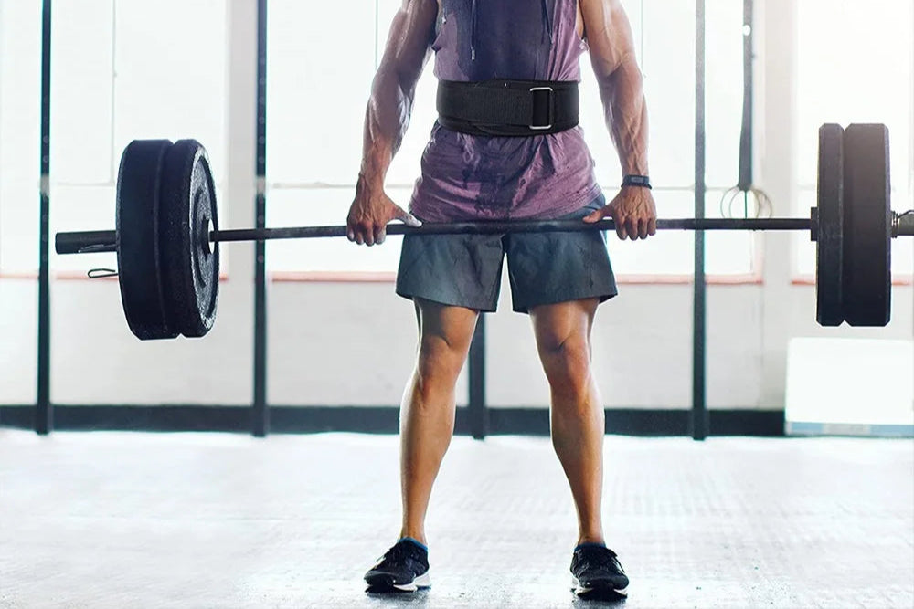 Man lifting a barbell in a gym setting