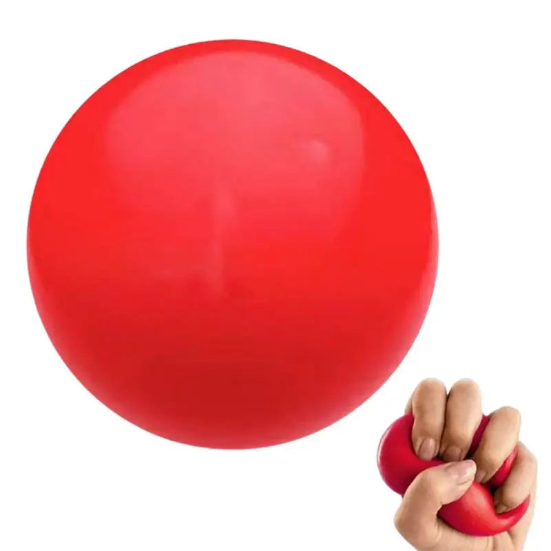 Red stress ball held in a hand on a white background