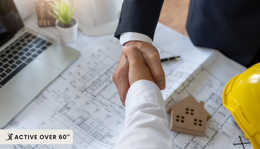 a person shaking hands with another person at a construction site