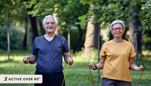A couple exercising with skipping ropes