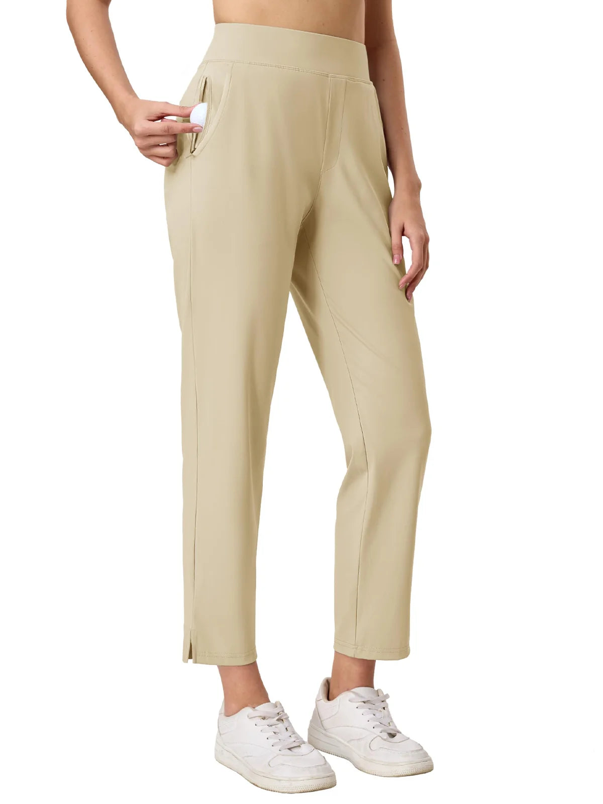 Beige pants worn by a person on a white background