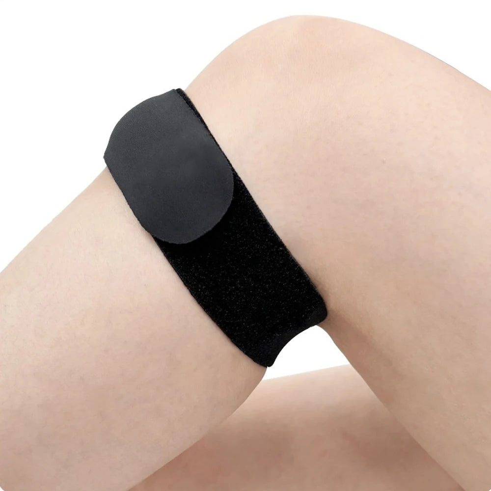 Black bandage on a person's knee against a white background