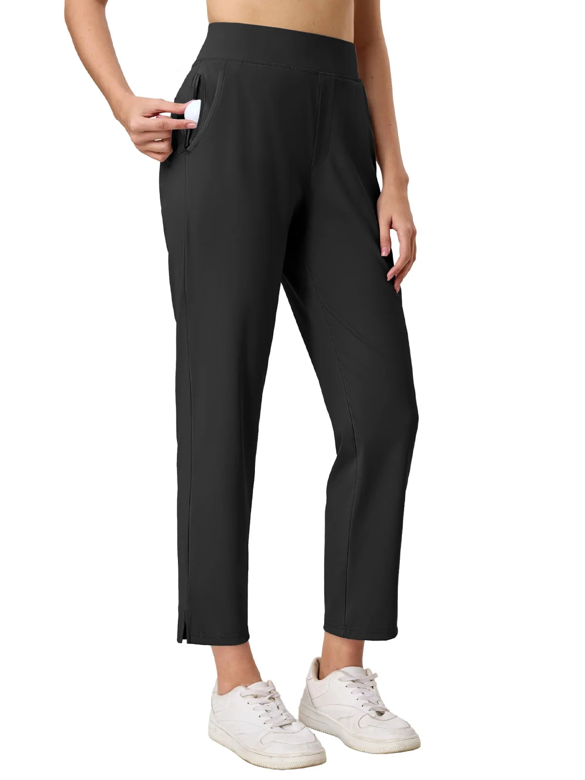 Black pants worn by a person on a white background
