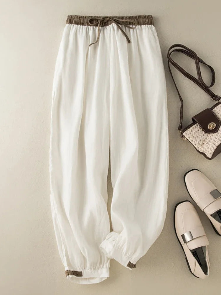 Casual white broadcloth pants with mid-rise elastic waist, perfect for all-season wear and relaxed fit.