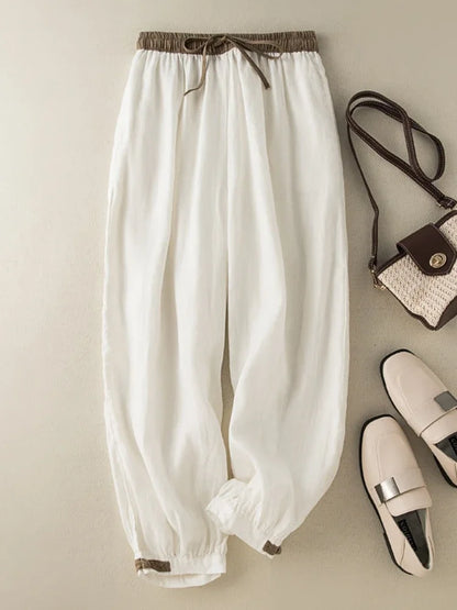 Casual white broadcloth pants with mid-rise elastic waist, perfect for all-season wear and relaxed fit.