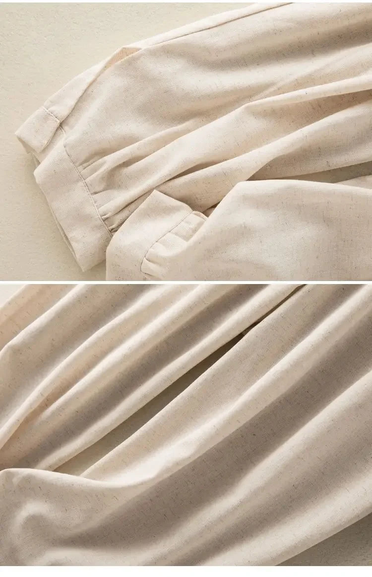 Close-up of beige fabric with a focus on texture and folds.