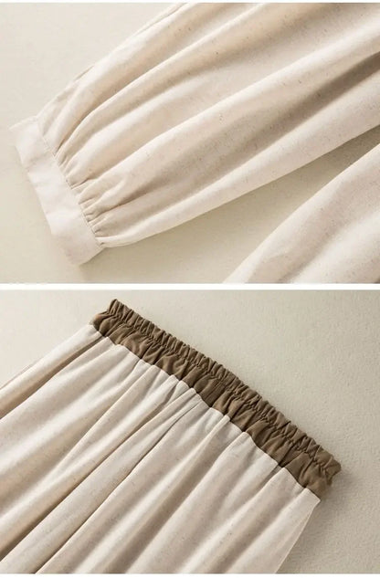 Close-up of beige fabric with brown trim on a plain background