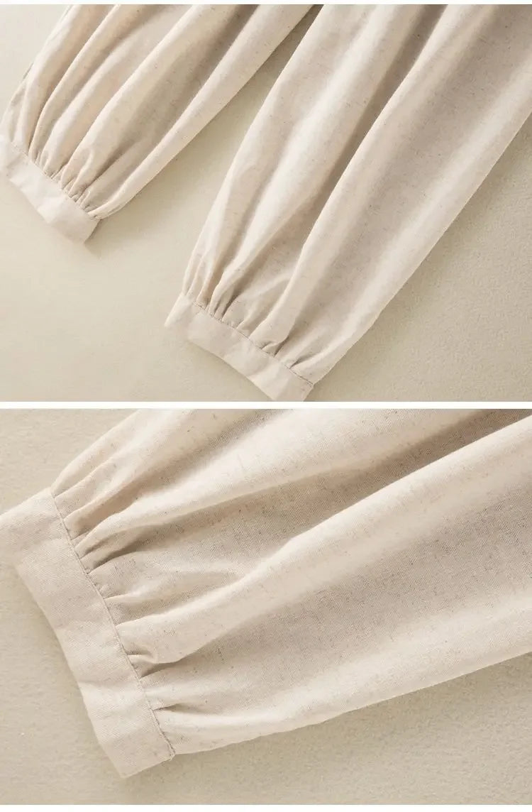 Close-up of beige pants with elastic waistband on a light beige background