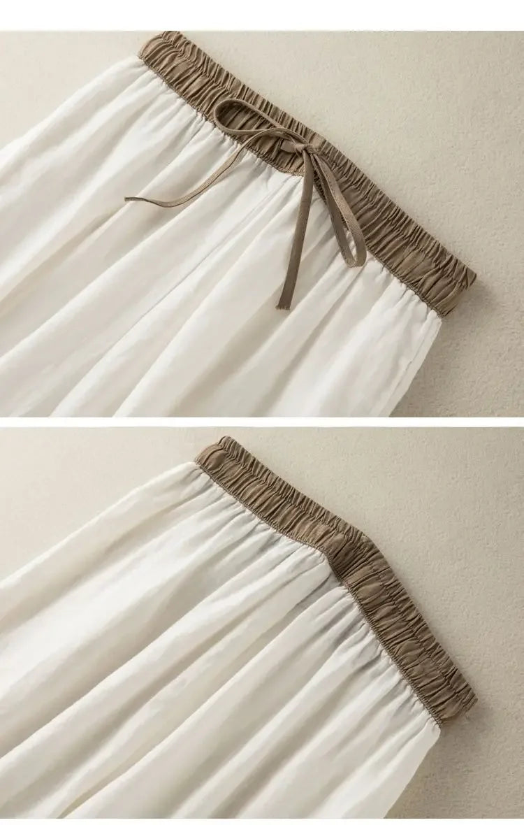 Comfortable white broadcloth pants with elastic waist, loose fit, and ankle-length style for daily activities.