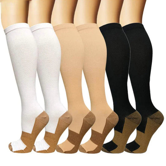 Set of knee-high socks in white, beige, and black on a white background