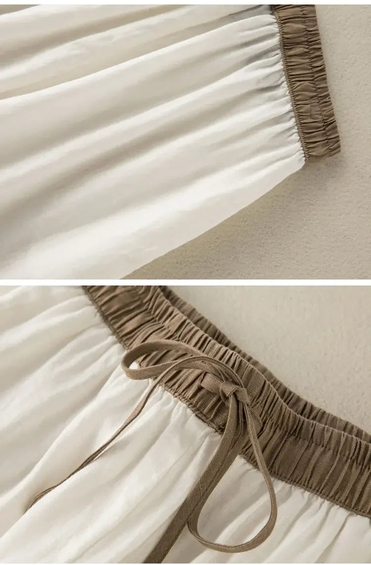 Durable cotton-linen blend pants in white with elastic waist and relaxed fit, designed for comfort and style.