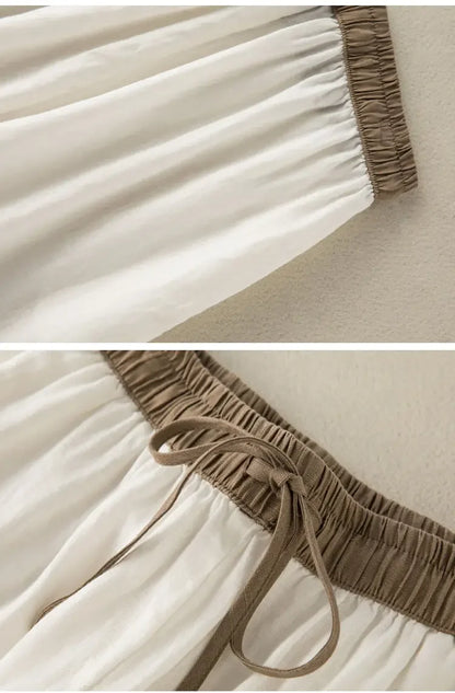 Durable cotton-linen blend pants in white with elastic waist and relaxed fit, designed for comfort and style.