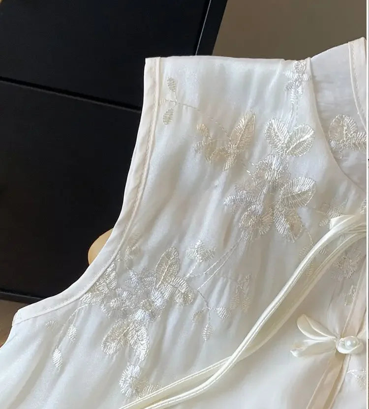 Close-up of embroidered detailing on soft blend fabric, highlighting the craftsmanship of this summer top for women 40+.