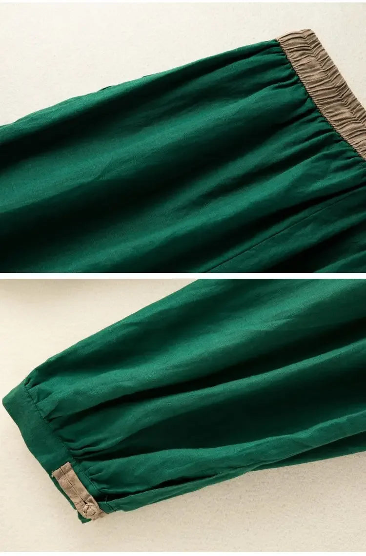 Green pants with brown waistband and hem on a beige background