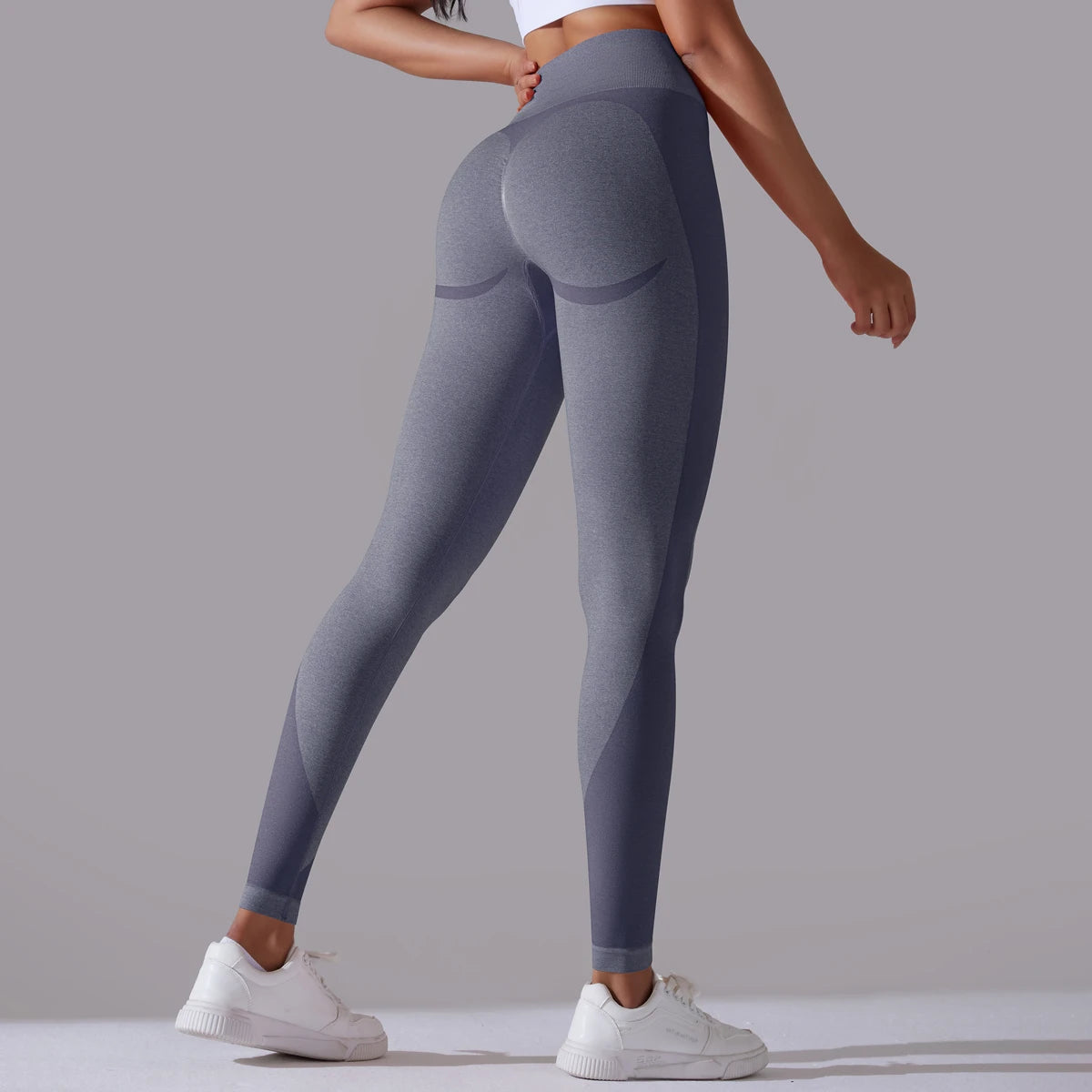 A pair of high-waist navy breathable nylon yoga leggings, featuring a wide elastic waistband and designed for active wear.