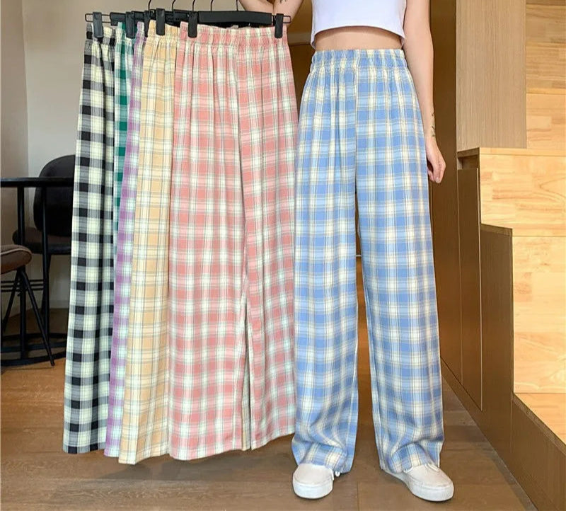 High-waisted plaid trousers featuring soft batik fabric and relaxed wide leg silhouette for everyday wear
