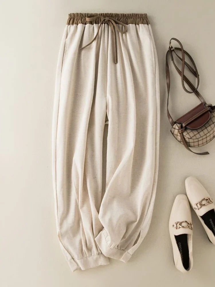 Lightweight apricot cotton and linen pants featuring a loose fit and ankle-length cut for everyday comfort.