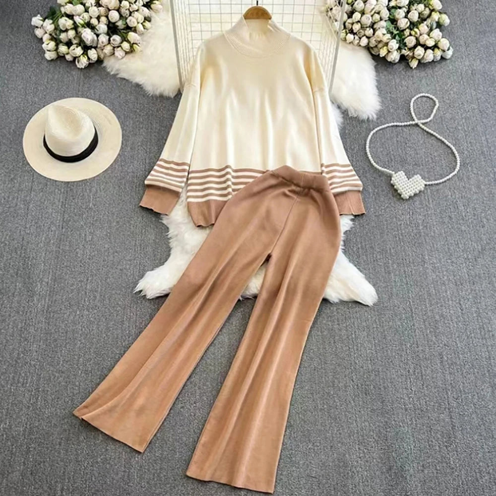 A loose knitted top in khaki  with brown stripes on the sleeves and a pair of wide-leg pants in a matching brown color, displayed against a white background.