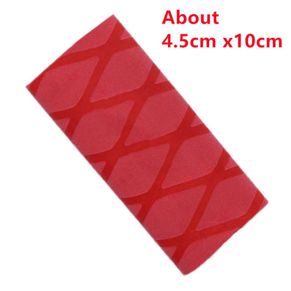 A heat shrink table tennis grip in the process of being installed, showing the red grip being shrunk onto the handle of the racket.