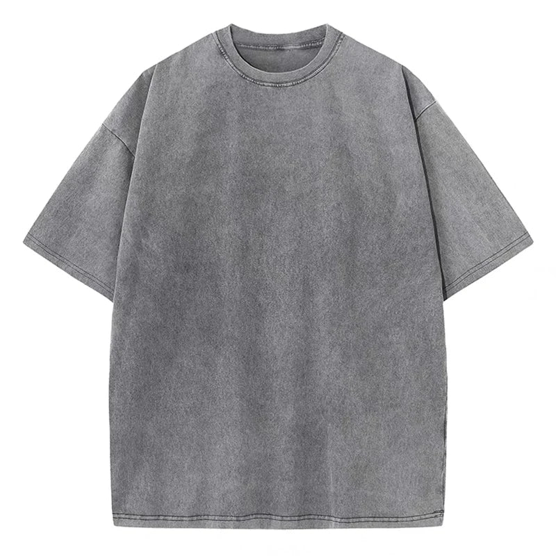 An oversized black cotton vintage casual t-shirt with short sleeves and a round neckline.