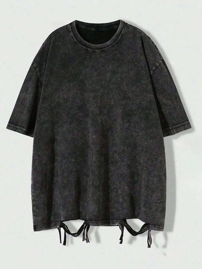An oversized black cotton vintage casual t-shirt with short sleeves and a round neckline.