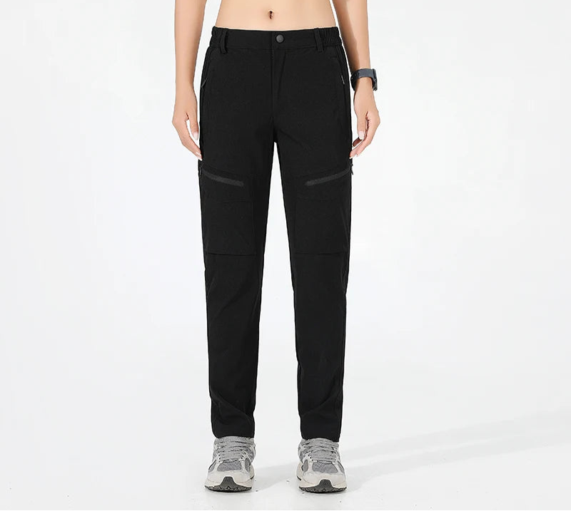 High-stretch women's hiking pants with breathable fabric, button fly closure, and moisture-wicking performance