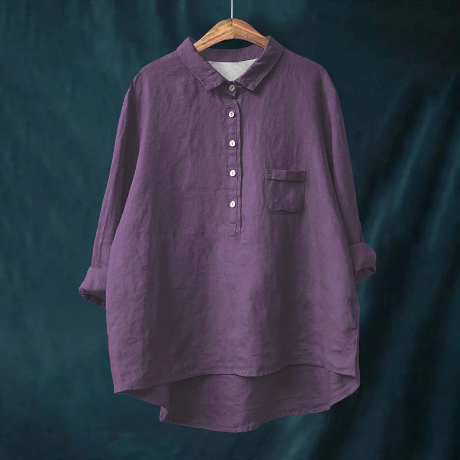 Elegant Floral Blouse for Vibrant Living displayed on hanger, showing vibrant pattern and non-stretch fabric texture.