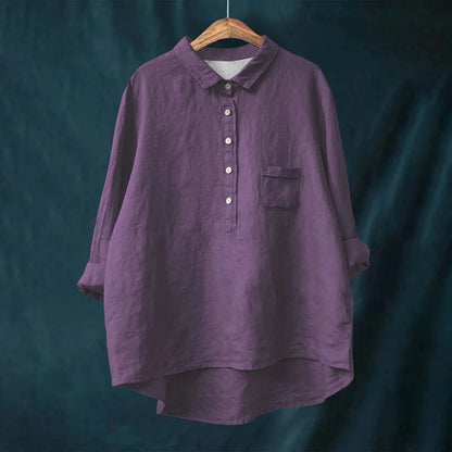Elegant Floral Blouse for Vibrant Living displayed on hanger, showing vibrant pattern and non-stretch fabric texture.