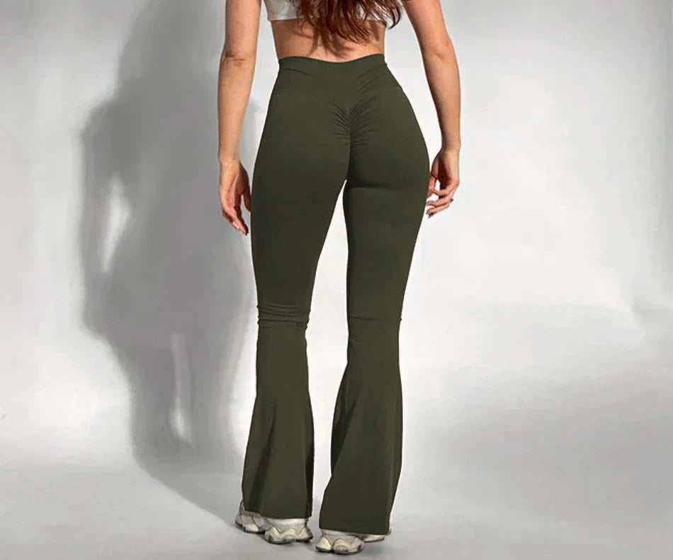
Solid color yoga pants with high waist support, flared legs, and breathable performance fabric