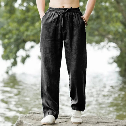 Senior man sitting comfortably in loose summer trousers outdoor