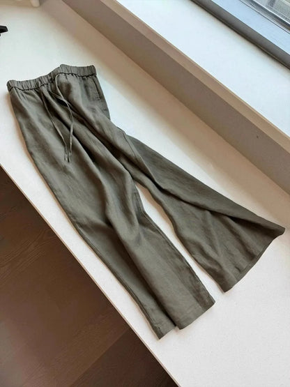 Comfortable linen trousers with wide legs, full length, and button closure