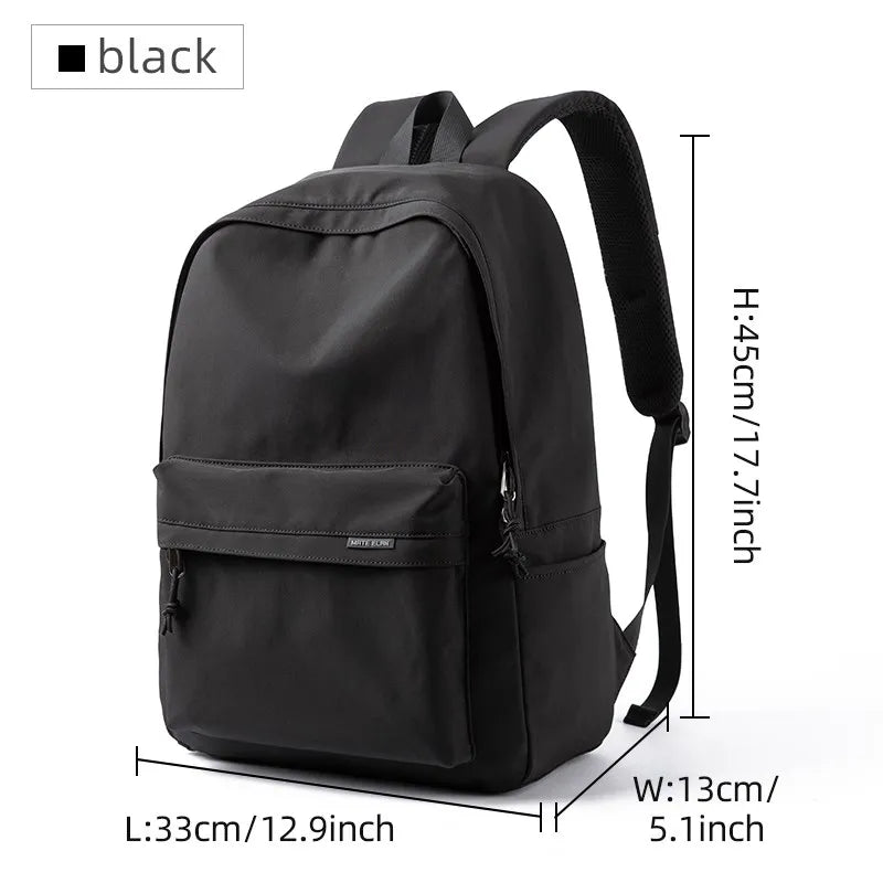A black lightweight waterproof sports travel backpack with a front pocket and side straps.