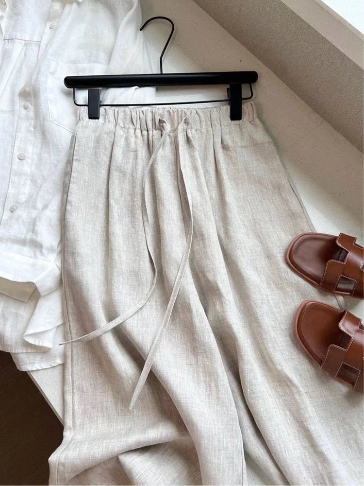 Full-length wide-leg linen pants in neutral tone for casual or office wear