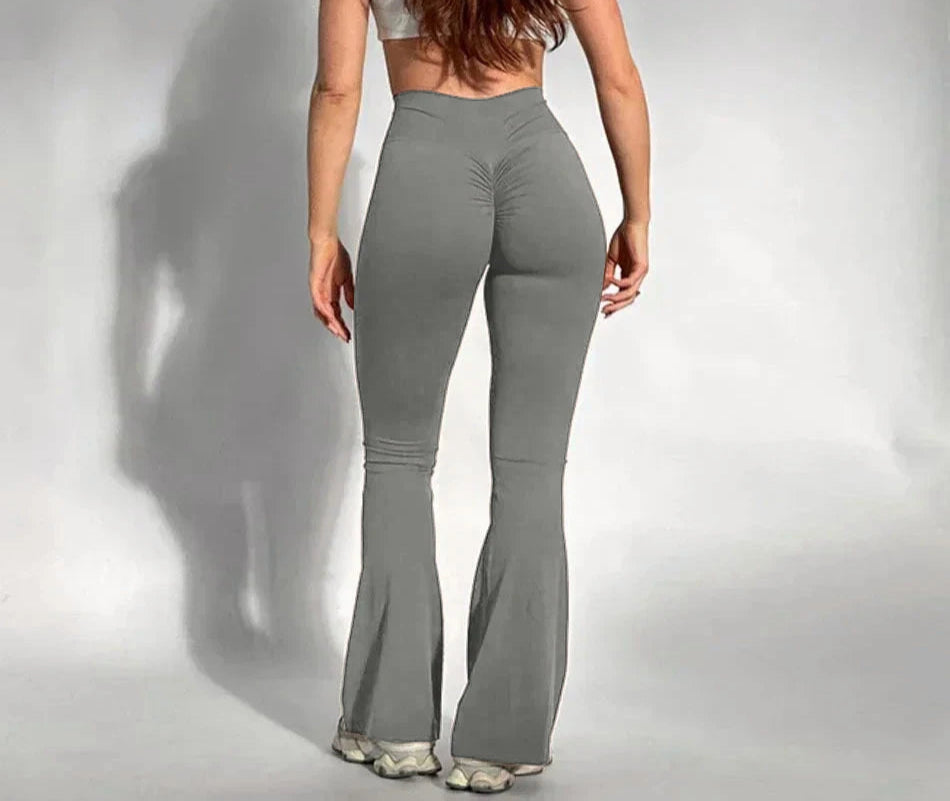 High waist scrunch butt leggings with flared ankle and fold detail in solid black polyester-spandex fabric