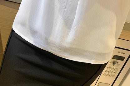 White chiffon top with stand-up collar, button accent, and lightweight feel for all-day comfort.