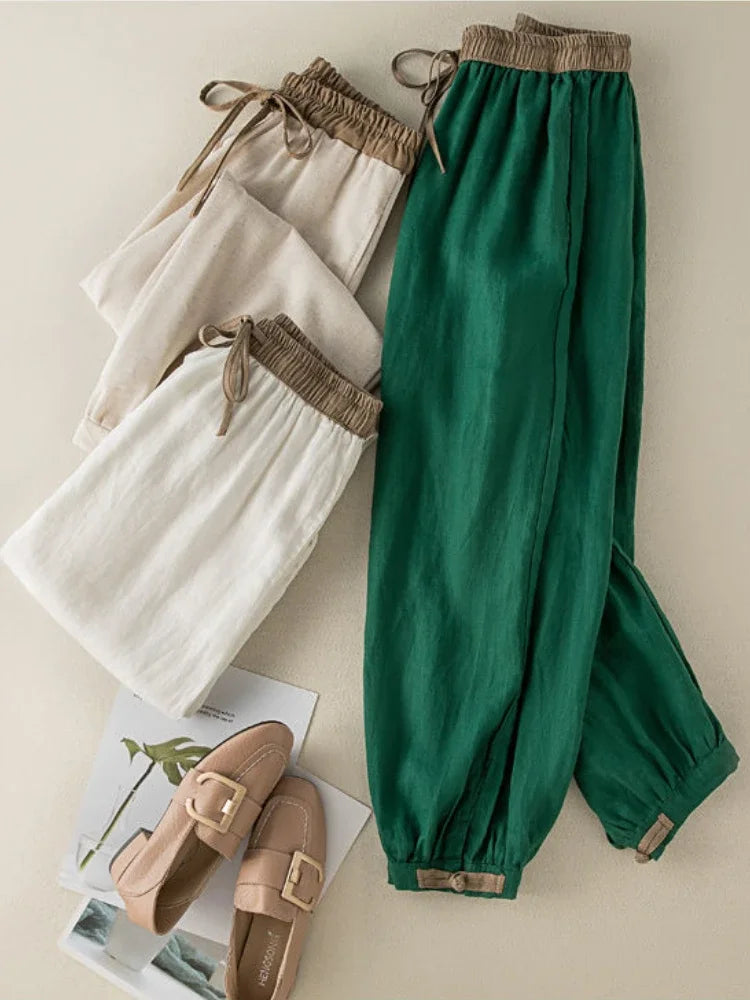 Solid green and white ankle-length pants made from soft cotton-linen fabric, combining style and breathable comfort.