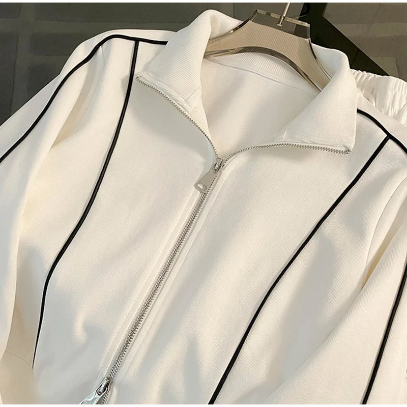 Stay cozy in this Striped Contrast Sweatshirt and Pants Set, designed with breathable fabric and a relaxed fit for all-day ease in closer view
