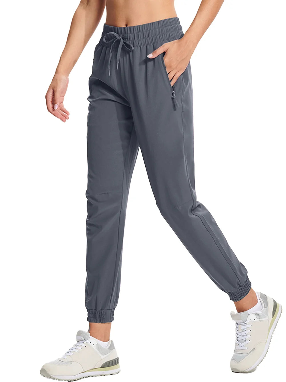 A pair of dark gray athletic pants with an elastic waistband and drawstring, featuring side pockets and a full-length design.