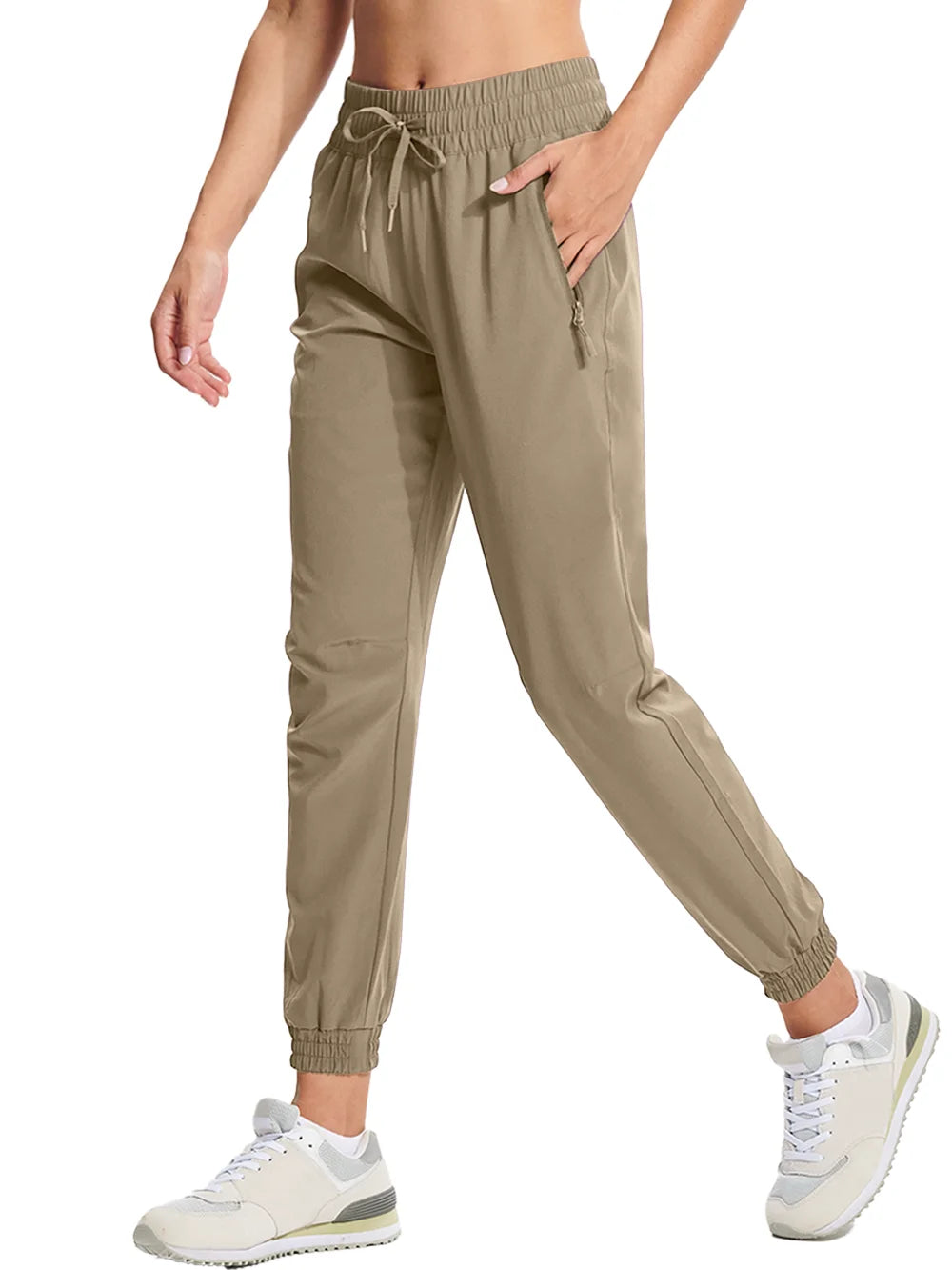 A pair of khaki athletic pants with an elastic waistband and drawstring, featuring side pockets and a full-length design.