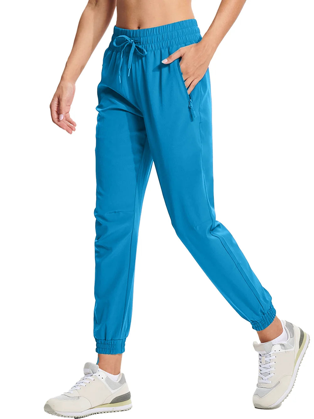 A pair of lake blue athletic pants with an elastic waistband and drawstring, featuring side pockets and a full-length design.