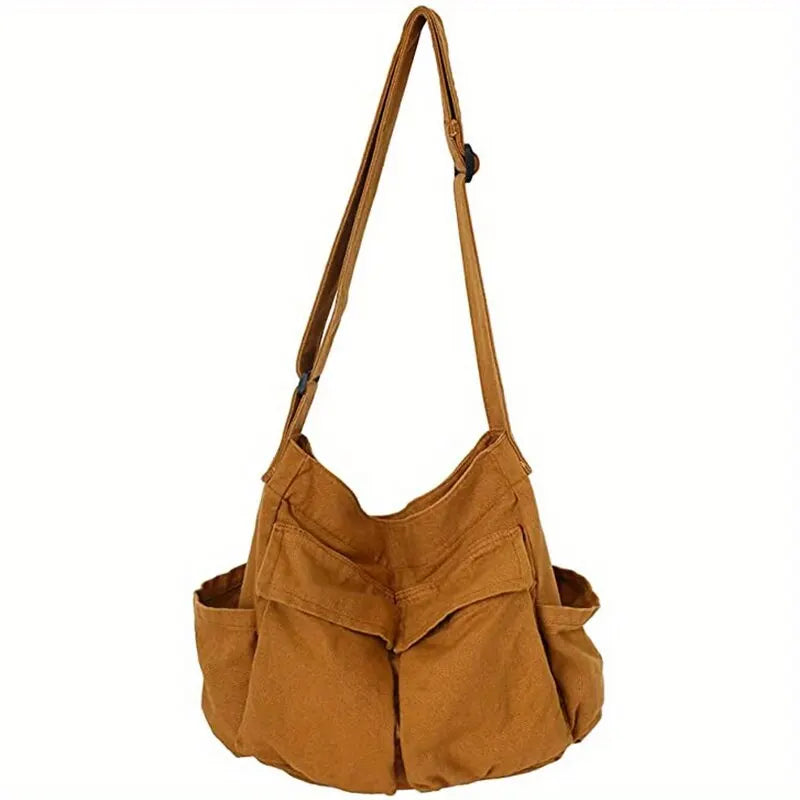 Versatile Vintage Canvas Crossbody Shoulder Bag worn as a shoulder bag.