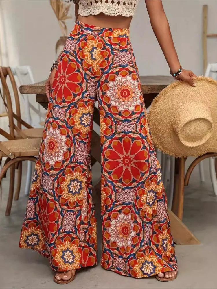 Wide leg printed high waist pants with elastic waistband and floral pattern in polyester broadcloth fabric