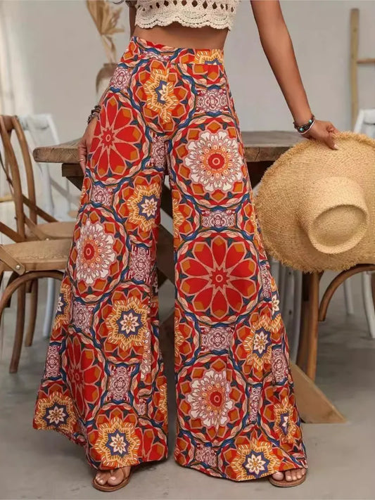 Wide leg printed high waist pants with elastic waistband and floral pattern in polyester broadcloth fabric