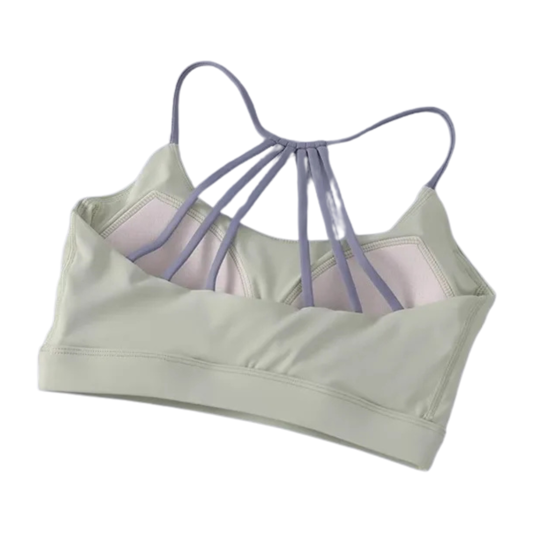 A collection of four women's cross-back yoga fitness bras in  back view displayed against a white background.